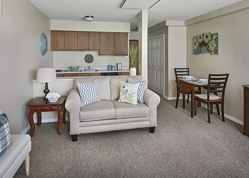Kitchenette and family room of an apartment at American House Livonia, a retirement community in Livonia, Michigan