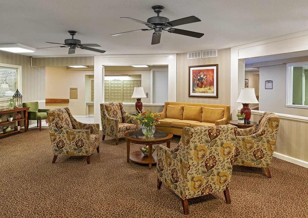 A common area with comfortable looking seats in American House Retirement Home in Northwest Westland, MI