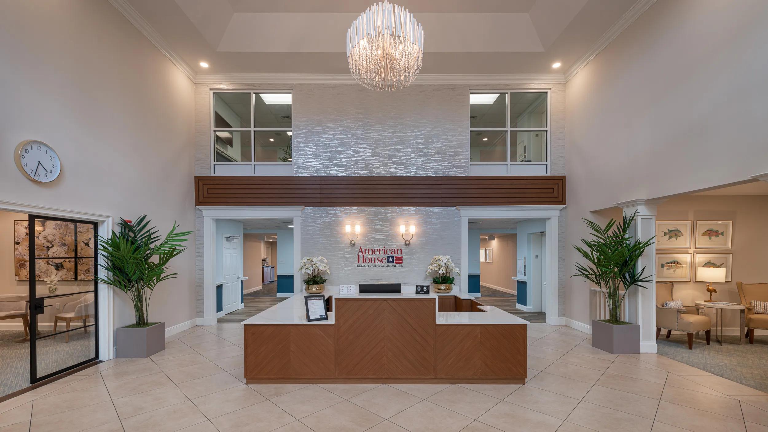 lobby at entry way with american house senior living communities logo sign